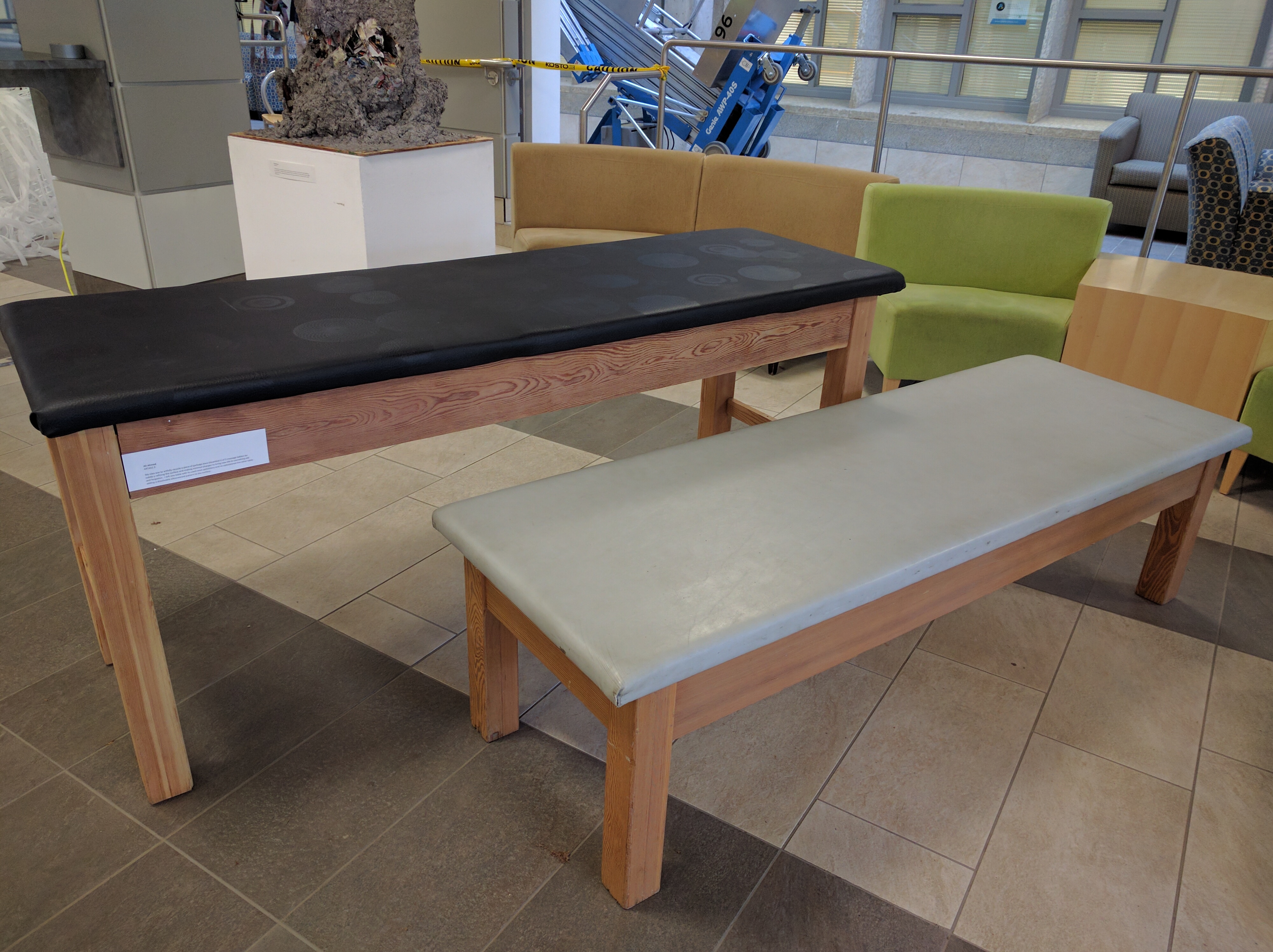 A set of massage tables -- one refurbished -- made by art student Ali Ahmed