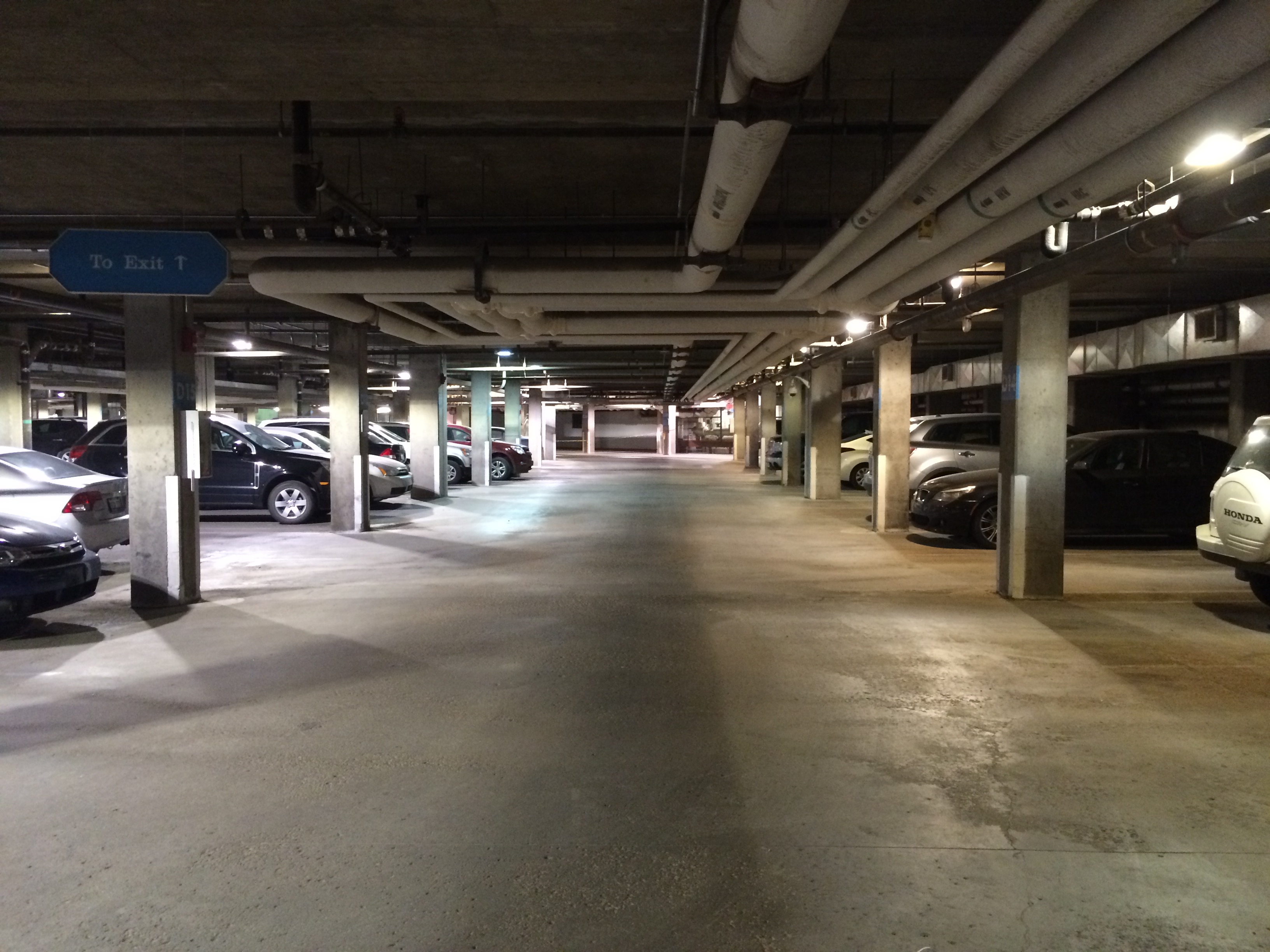 A comparison of the lighting in the Agriculture Parkade before and after its LED lighting installation.