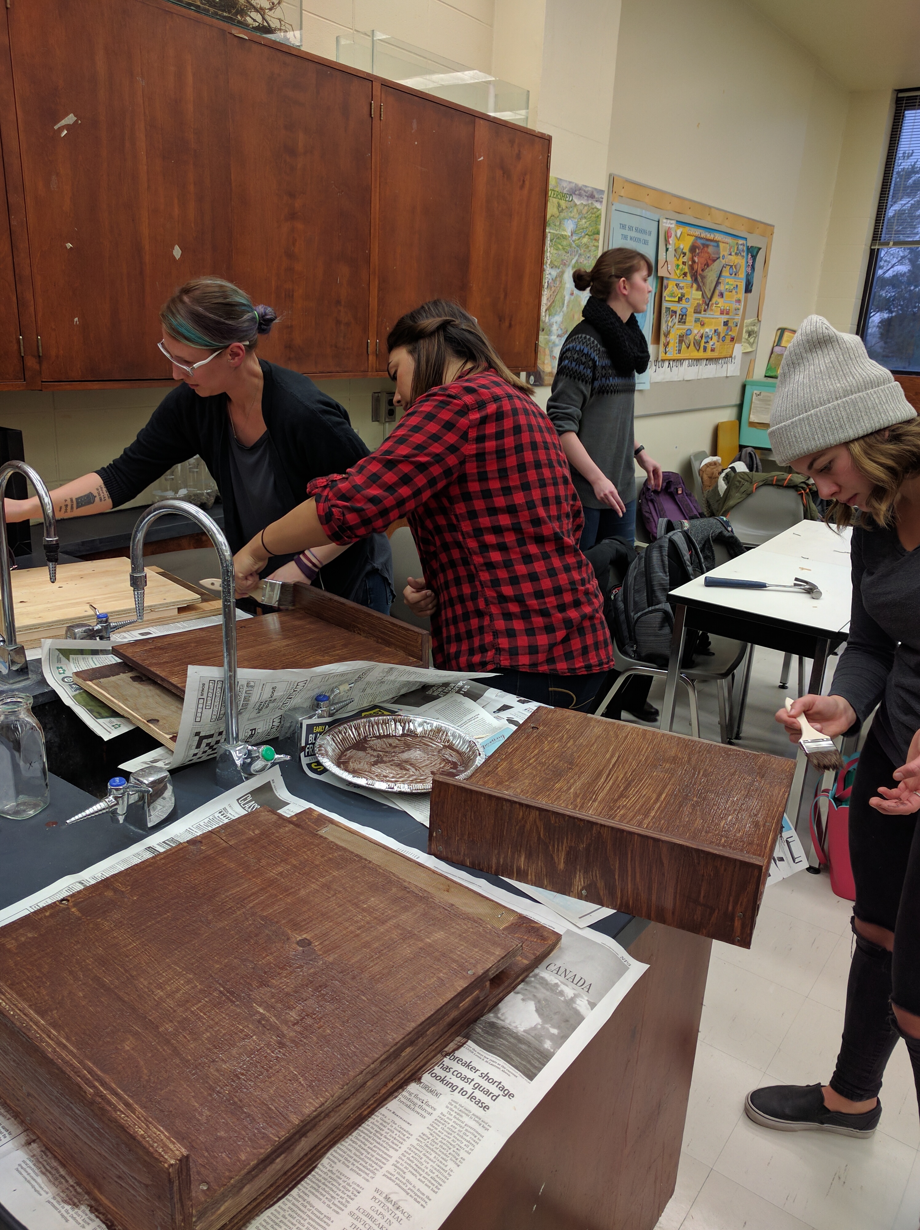 Students stain their bat boxes to aid heat absorption, giving bats a warm place to sleep.